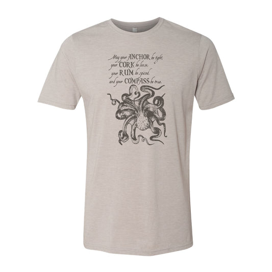 Beige t-shirt with black kraken design and text on a white background