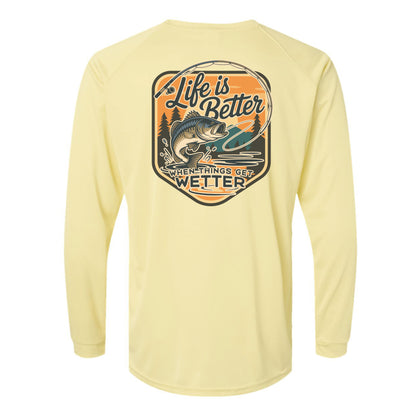 Yellow long-sleeve shirt with a fishing graphic and text on a white background